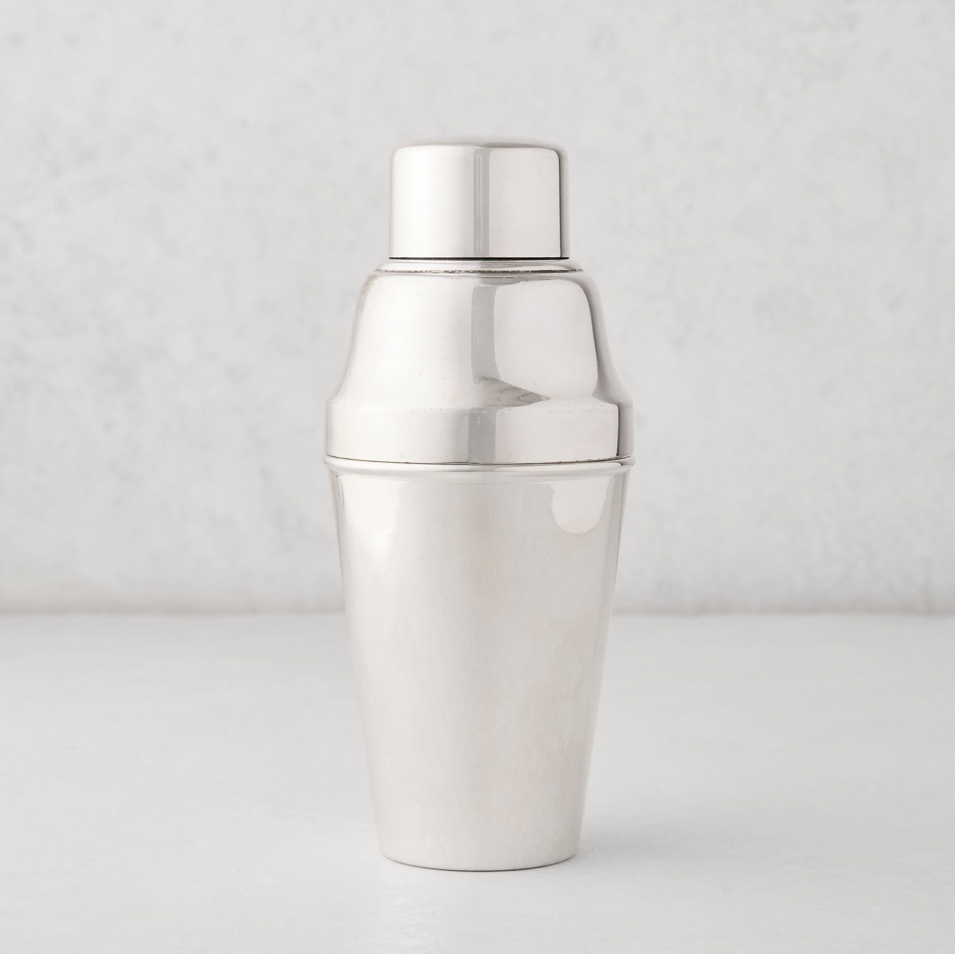 Vintage silverplate Hallie cocktail shaker with a shiny, smooth finish.