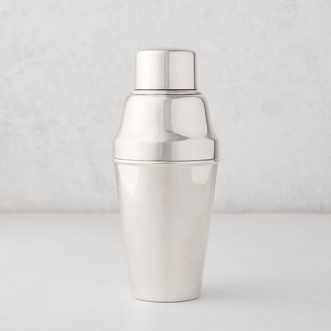 Vintage silverplate Hallie cocktail shaker with a shiny, smooth finish.