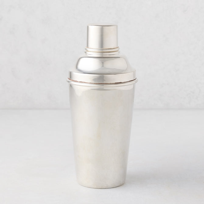 Vintage silverplate cocktail shaker with ivy design.
