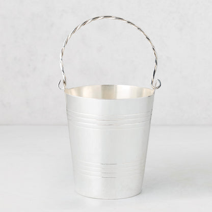Vintage silverplate James ice bucket with a twisted handle and horizontal bands.