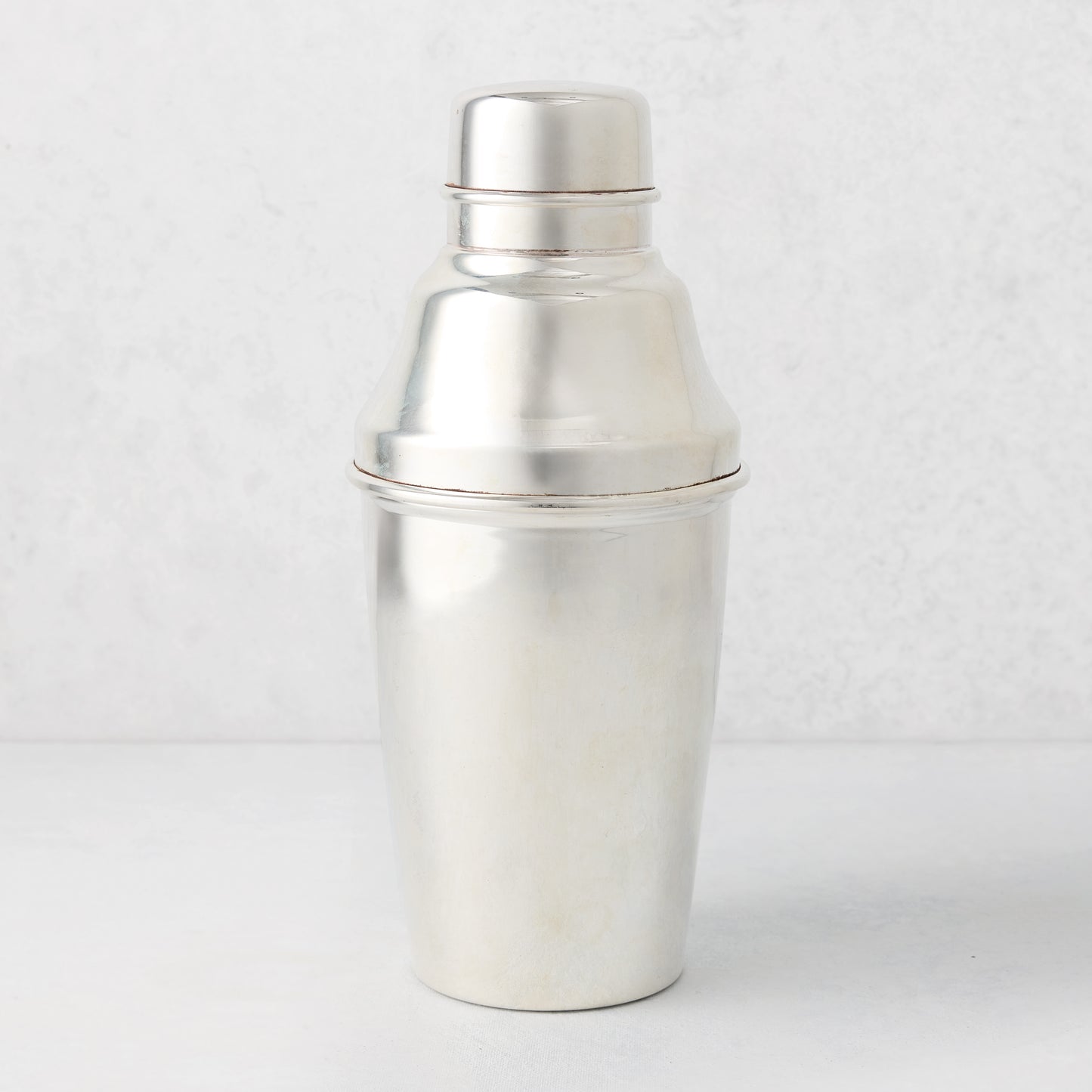 Vintage silverplate Jules cocktail shaker with lid, classic design.