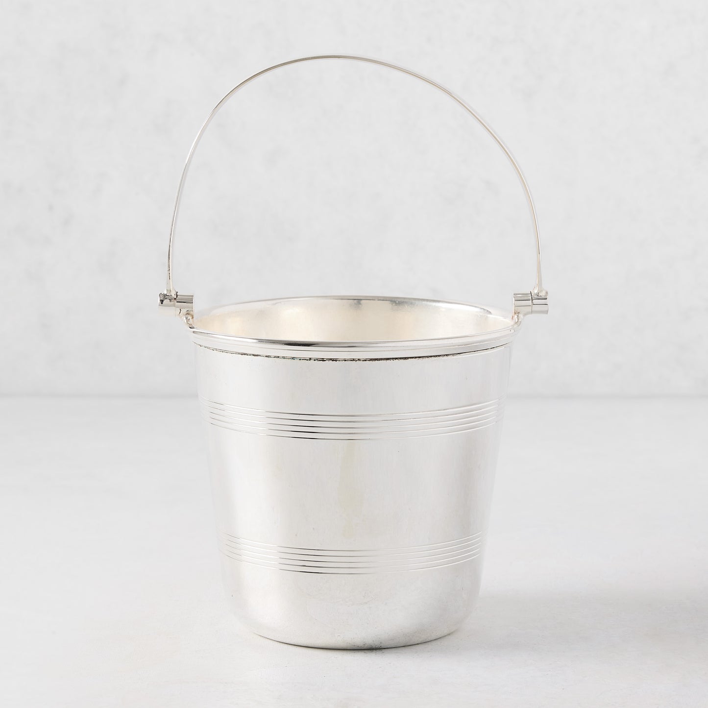 Vintage silverplate Lorelei ice bucket with a double-lined design and a polished silver finish.