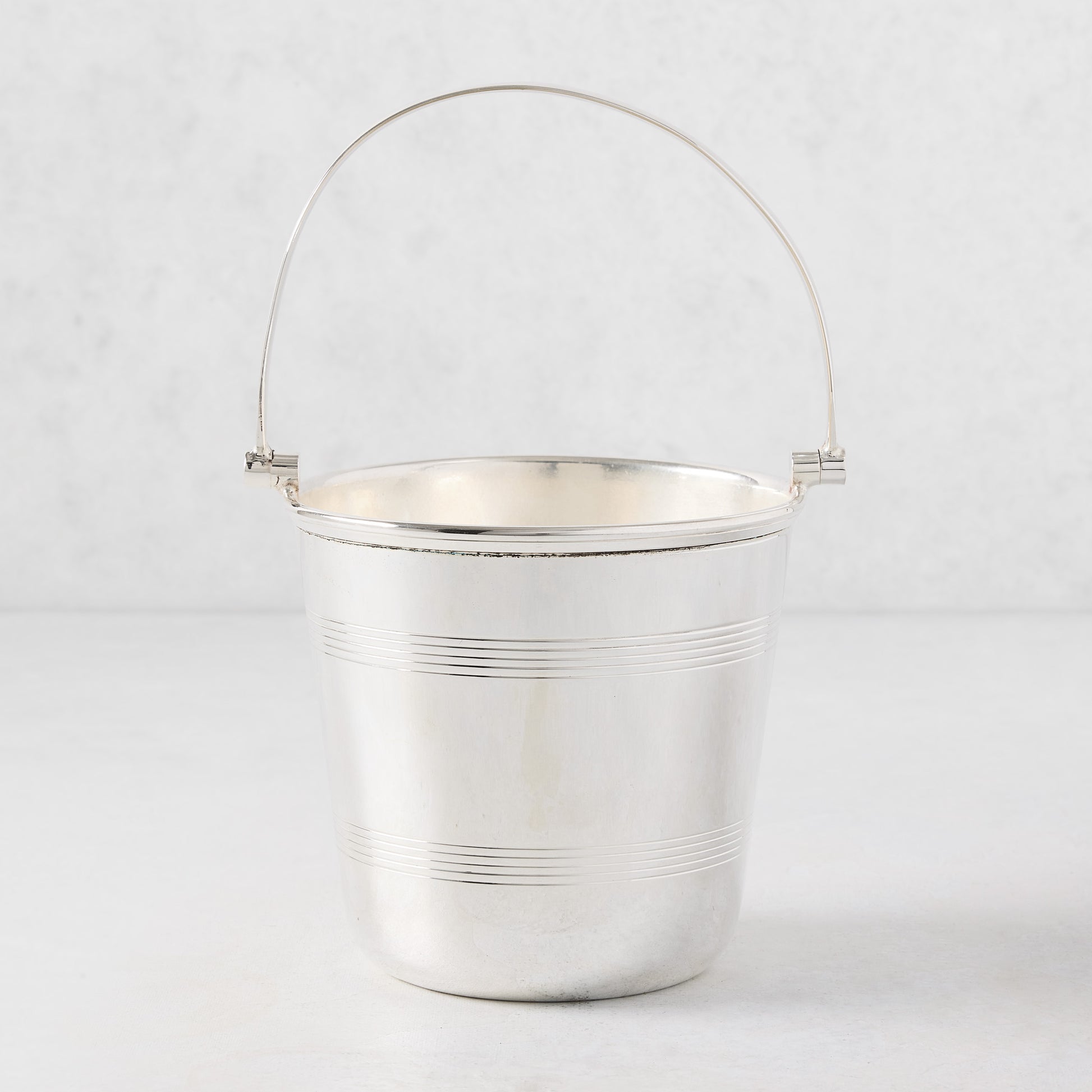 Vintage silverplate Lorelei ice bucket with a double-lined design and a polished silver finish.