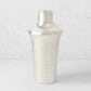 Vintage silverplate Mira cocktail shaker with ribbed base and cap.