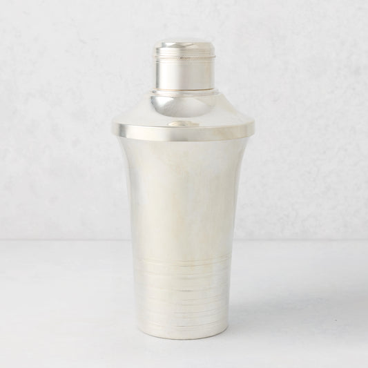 Vintage silverplate Mira cocktail shaker with ribbed base and cap.