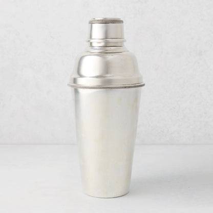 Vintage silverplate Nola cocktail shaker with a textured band.