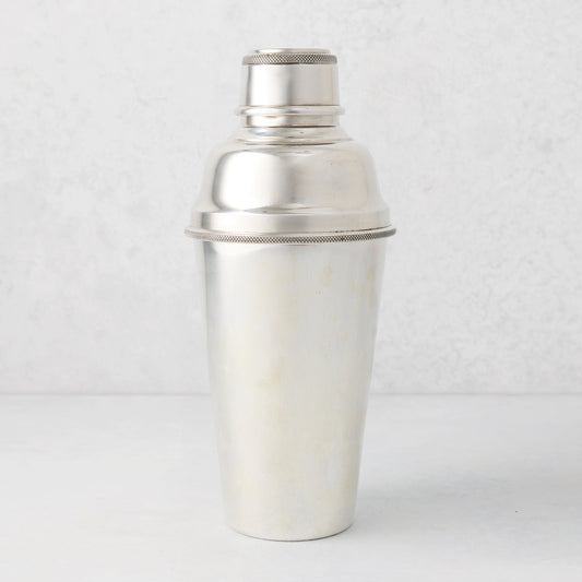 Vintage silverplate Nola cocktail shaker with a textured band.