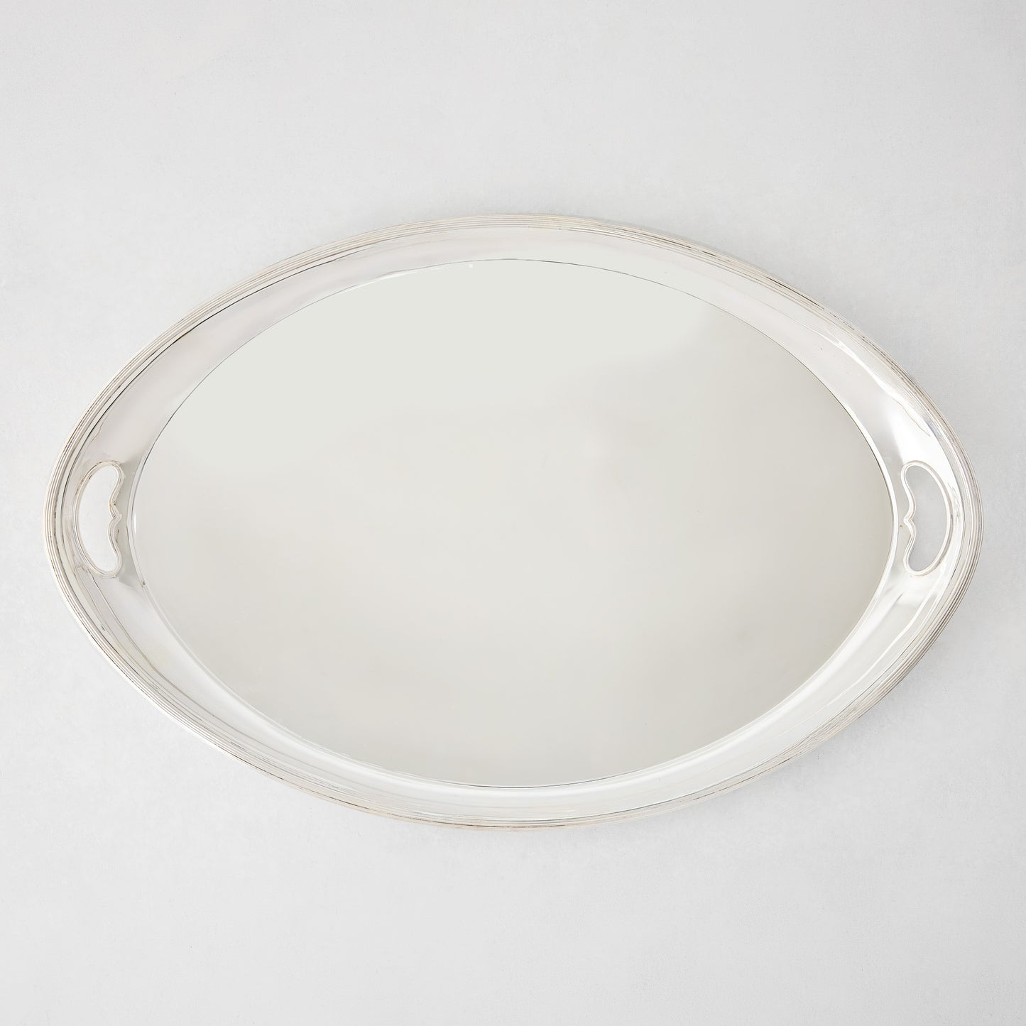Vintage silverplate oblong Leela angled tray with ornate handles.