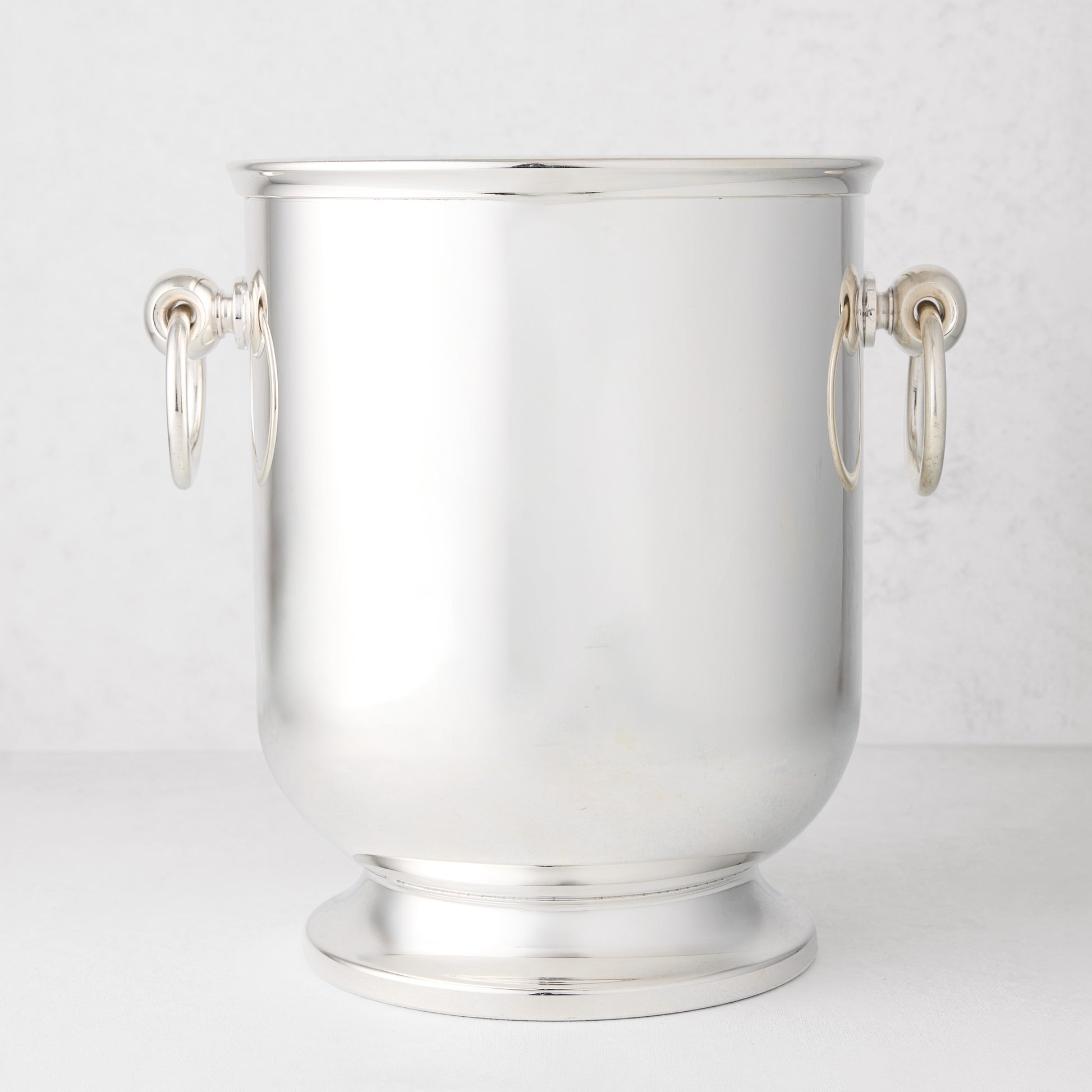 Vintage silverplate olive champagne bucket with ring handles.