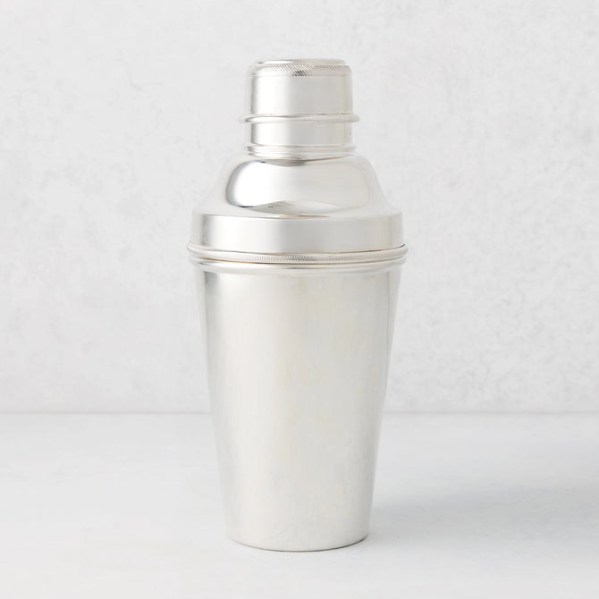 Vintage silverplate Ophelia cocktail shaker, sleek and polished, with a ribbed cap.
