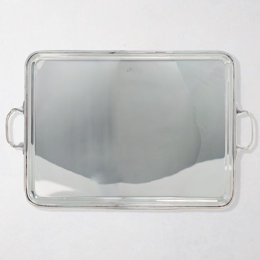 Vintage rectangular silverplate handled serving tray with polished finish.