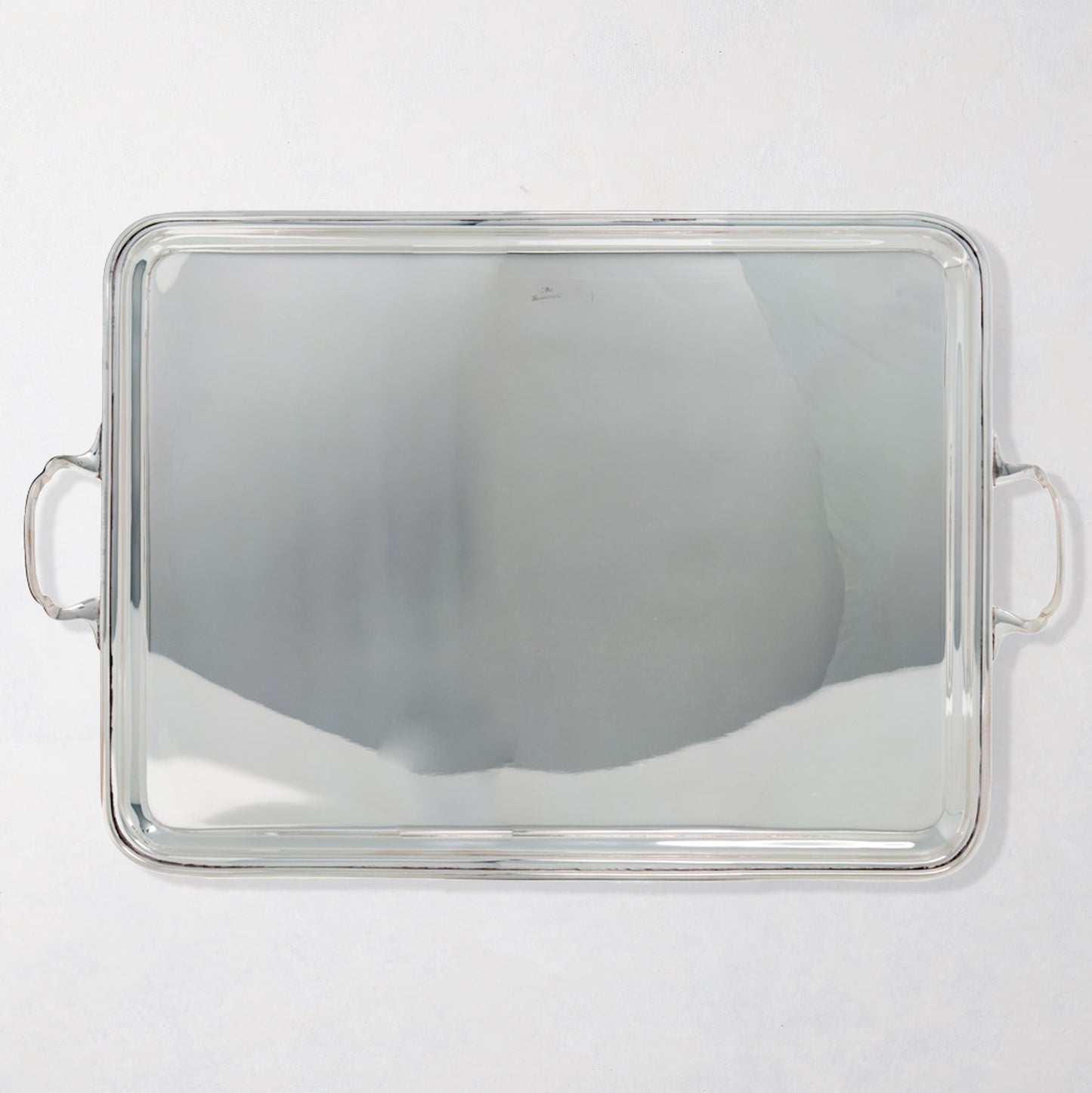Vintage rectangular silverplate handled serving tray with polished finish.