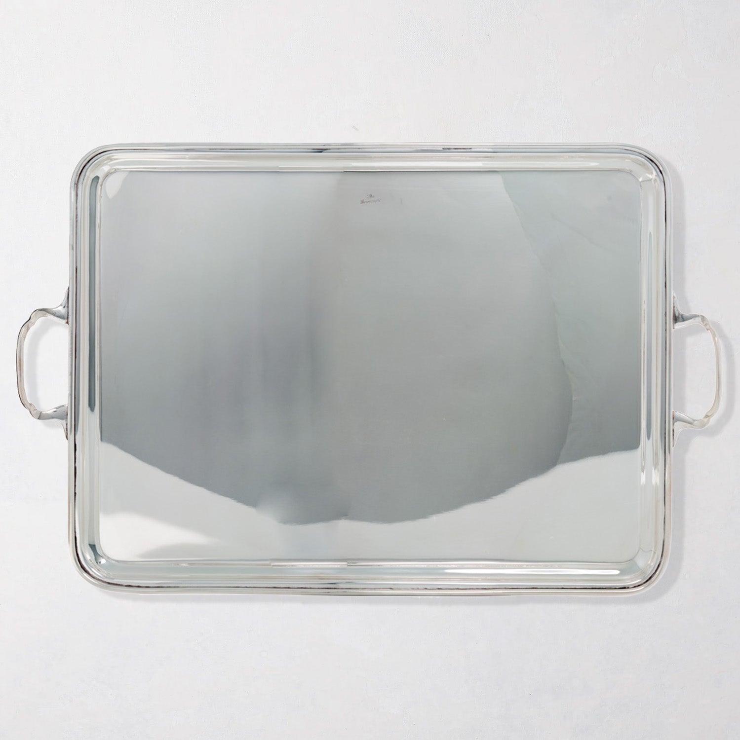 Vintage rectangular silverplate handled serving tray with polished finish.