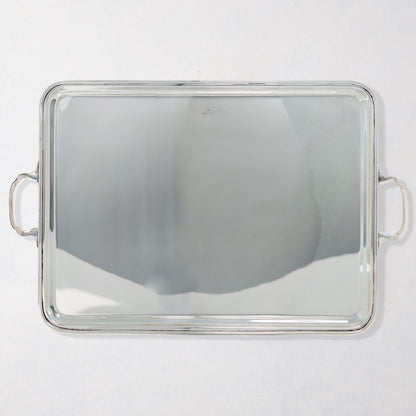 Vintage rectangular silverplate handled serving tray with polished finish.