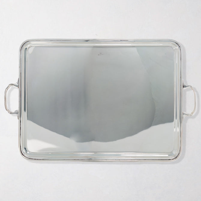 Vintage rectangular silverplate handled serving tray with polished finish.