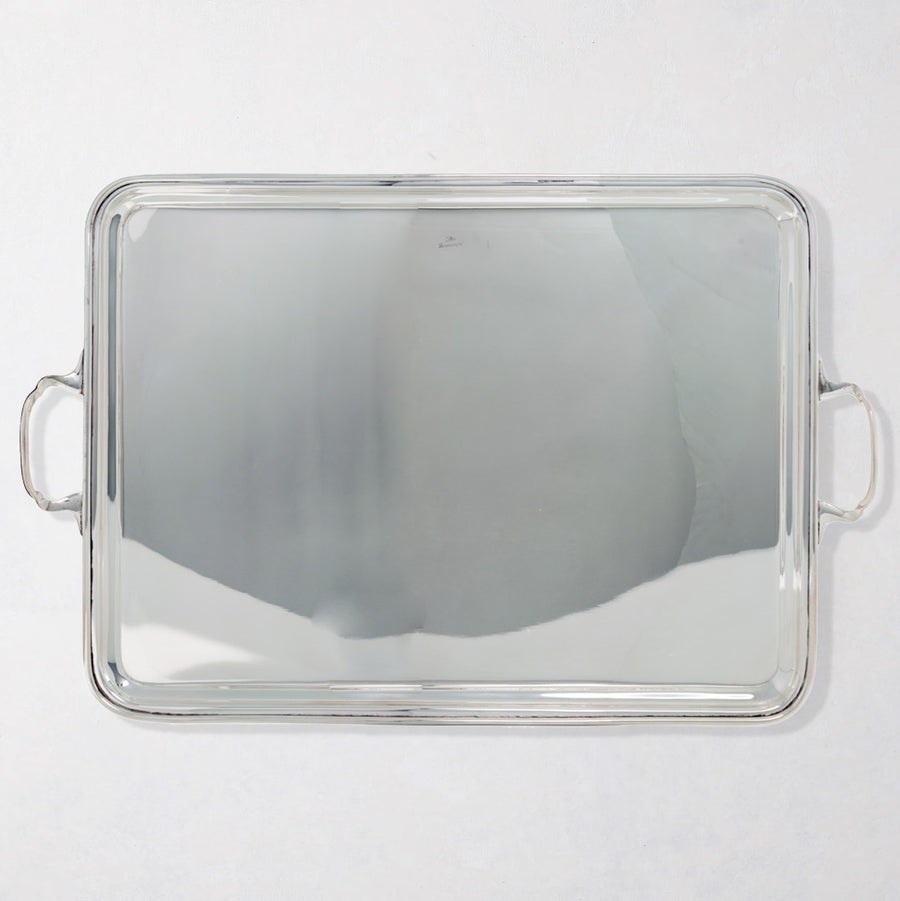Vintage rectangular silverplate handled serving tray with polished finish.
