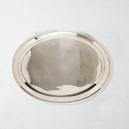 Vintage silverplate oval platter with a polished, reflective surface and simple double-rim design.
