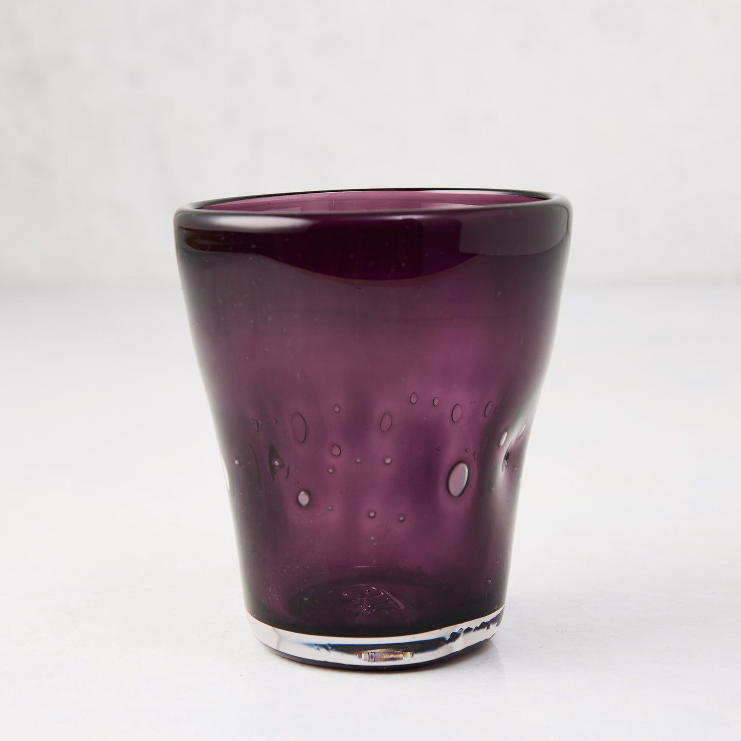 Violet Henri 8 oz. mouth-blown glass with unique air bubbles and slight asymmetry.