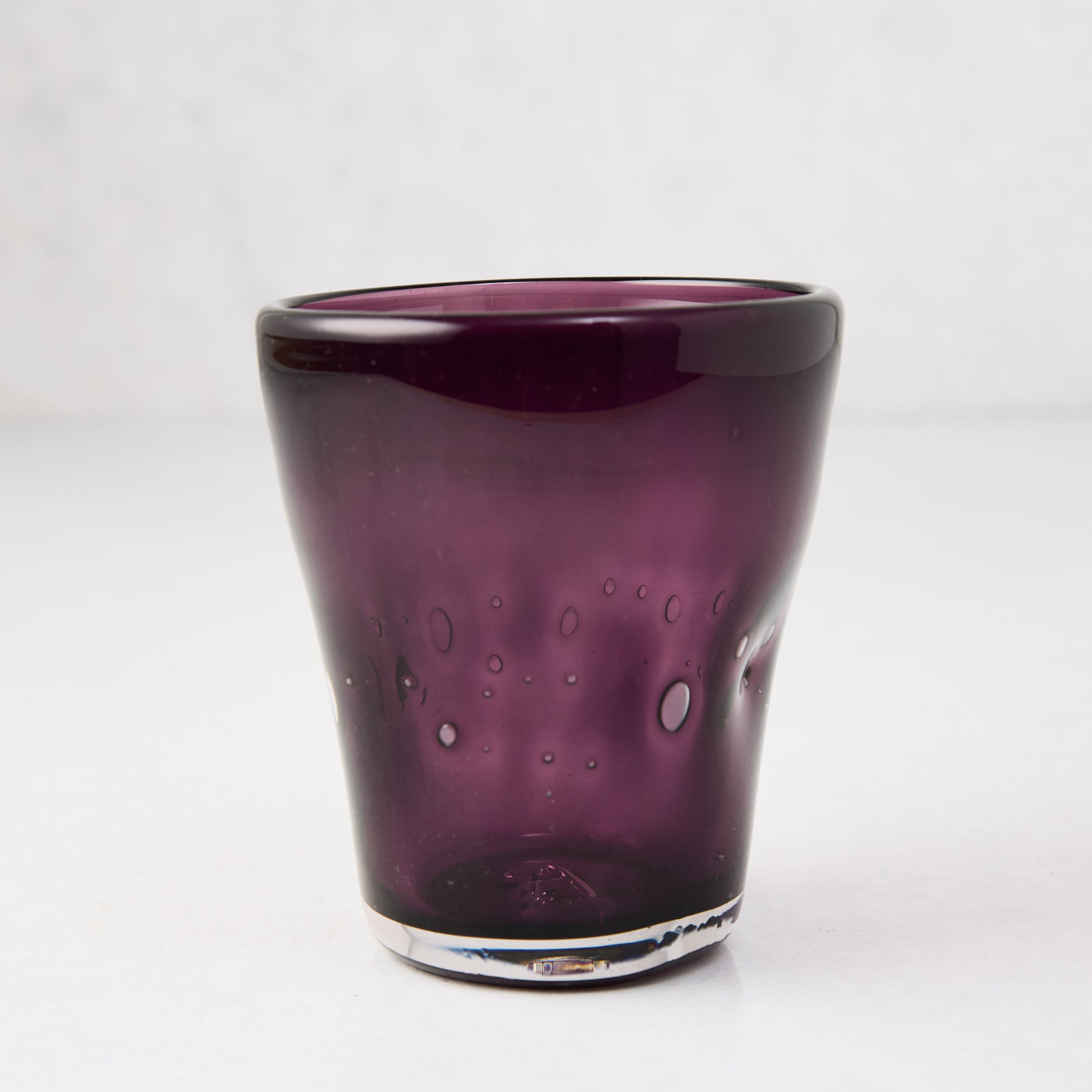 Violet Henri 8 oz. mouth-blown glass with unique air bubbles and slight asymmetry.