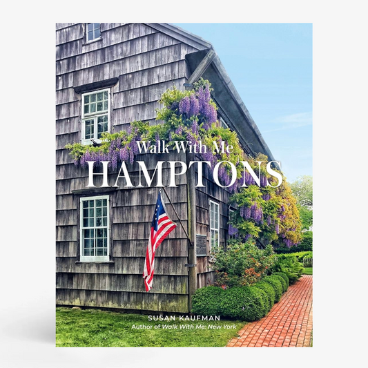 Walk with Me: Hamptons" book cover featuring a rustic shingle house with purple wisteria and an American flag.