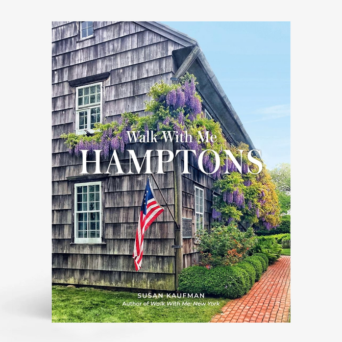 Walk with Me: Hamptons" book cover featuring a rustic shingle house with purple wisteria and an American flag.