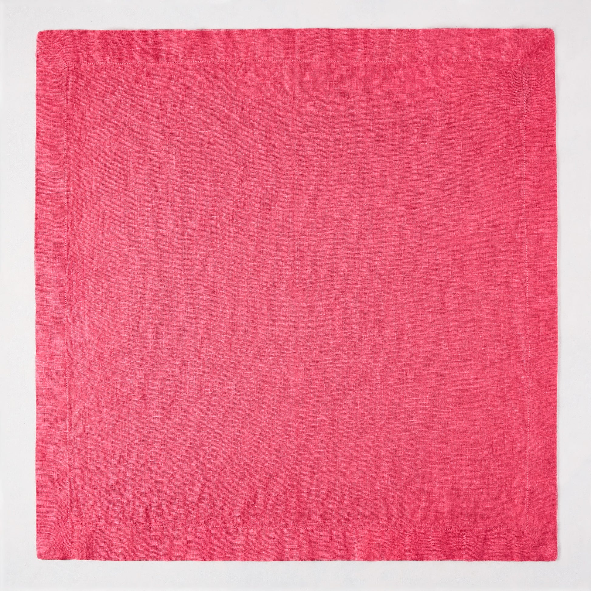 Watermelon HG Signature hand-dyed 22" square linen napkin in vibrant hot pink with mitered corners.