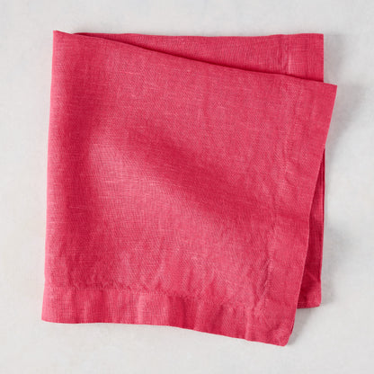 Watermelon HG Signature hand-dyed 22-inch square linen napkin, folded.