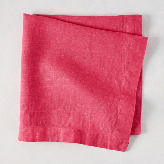 Watermelon HG Signature hand-dyed 22-inch square linen napkin, folded.