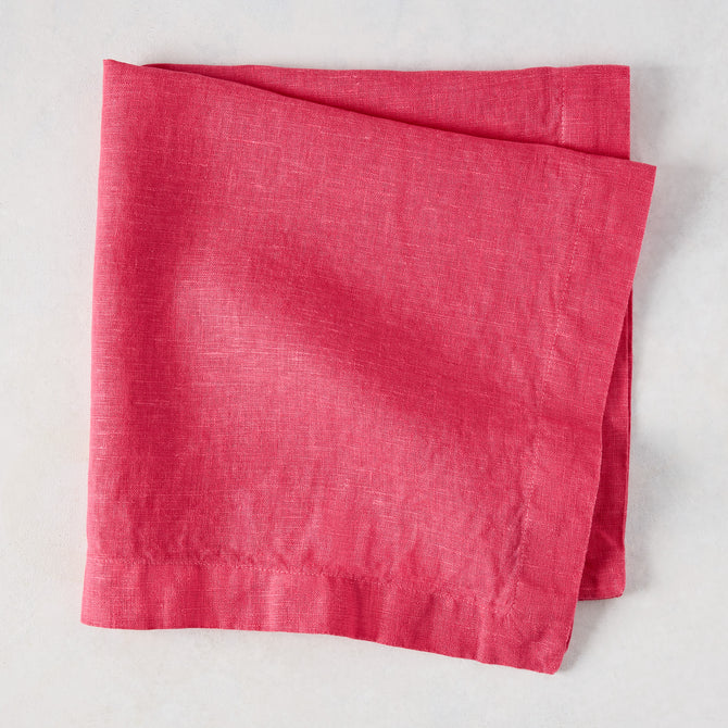 Watermelon HG Signature hand-dyed 22-inch square linen napkin, folded.