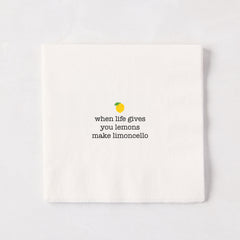 White 5.5" square paper cocktail napkin with "when life gives you lemons make limoncello" text and lemon graphic.