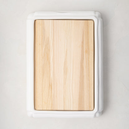 White ceramic handled cutting board with light oak wood surface, 18"L x 13"W.