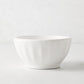 White ceramic latte bowl, 5.5" diameter, with subtle fluted sides.