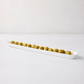 White ceramic olive serving tray, 16" long, filled with green olives.