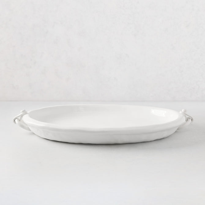 White ceramic oval platter with faux strap ring handles, 22.5"L.