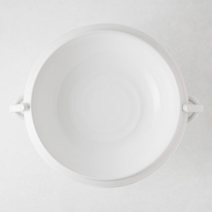 White ceramic pedestal fruit bowl, 17"Dia, with ring handles and wide rim.