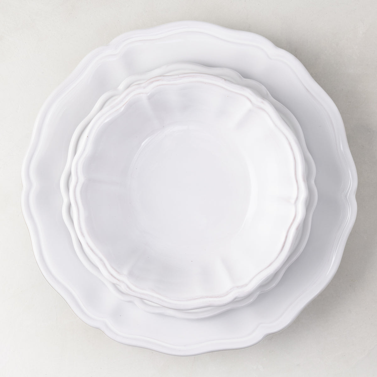 Handmade white ceramic bowl and plate set with scalloped edges, 7.4-inch diameter, Italian-style dinnerware.