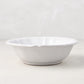 Handmade white ceramic bowl from the Deruta collection with a subtle scalloped edge, 7.4 inches in diameter.