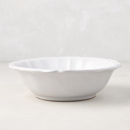 Handmade white ceramic bowl from the Deruta collection with a subtle scalloped edge, 7.4 inches in diameter.