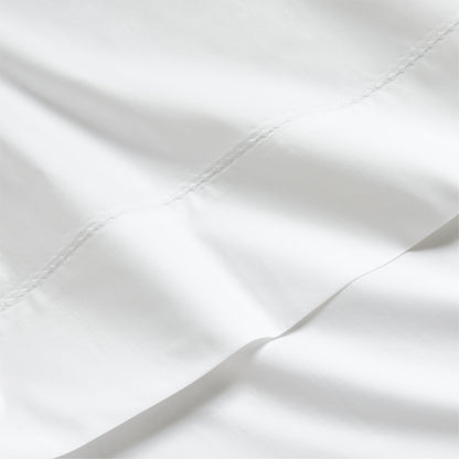 White Diamond Percale Sheet Set, crisp white extra-long staple cotton with subtle diamond embroidery.