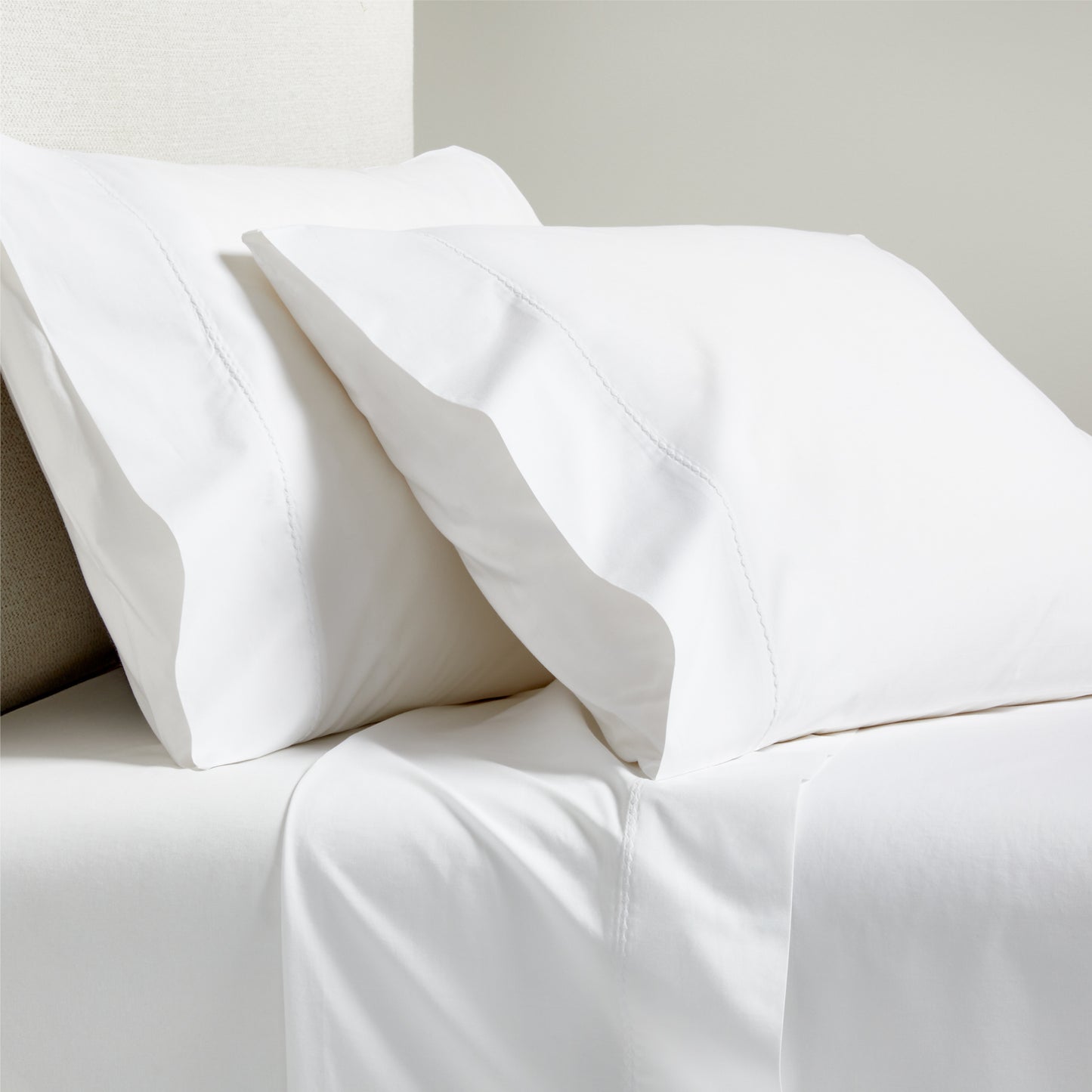 White Diamond Percale Sheet Set: crisp white cotton percale sheets and pillowcases with tailored diamond detail.