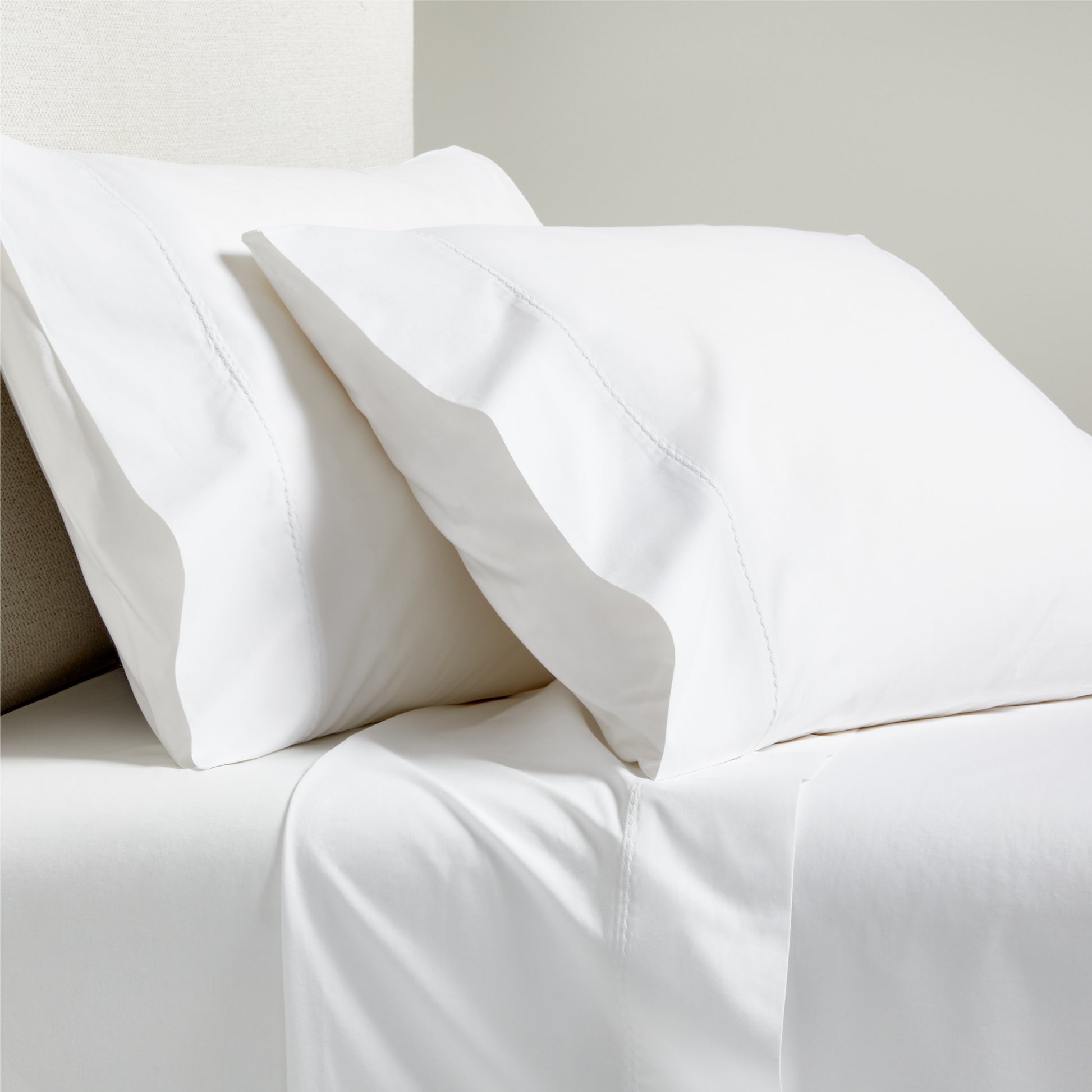 White Diamond Percale Sheet Set: crisp white cotton percale sheets and pillowcases with tailored diamond detail.