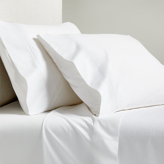 White Diamond Percale Sheet Set: crisp white cotton percale sheets and pillowcases with tailored diamond detail.