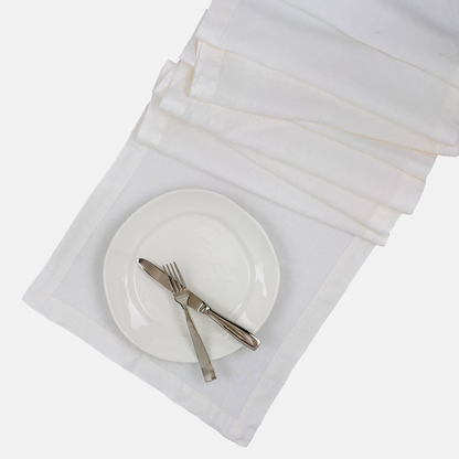 White HG Hand-dyed Linen Table Runner, 18"x108", with mitered corners and a plate setting.