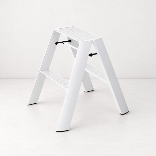 White Hasegawa Lucano 2-step ladder in matte white aluminum and steel with grooved treads and black safety latches.