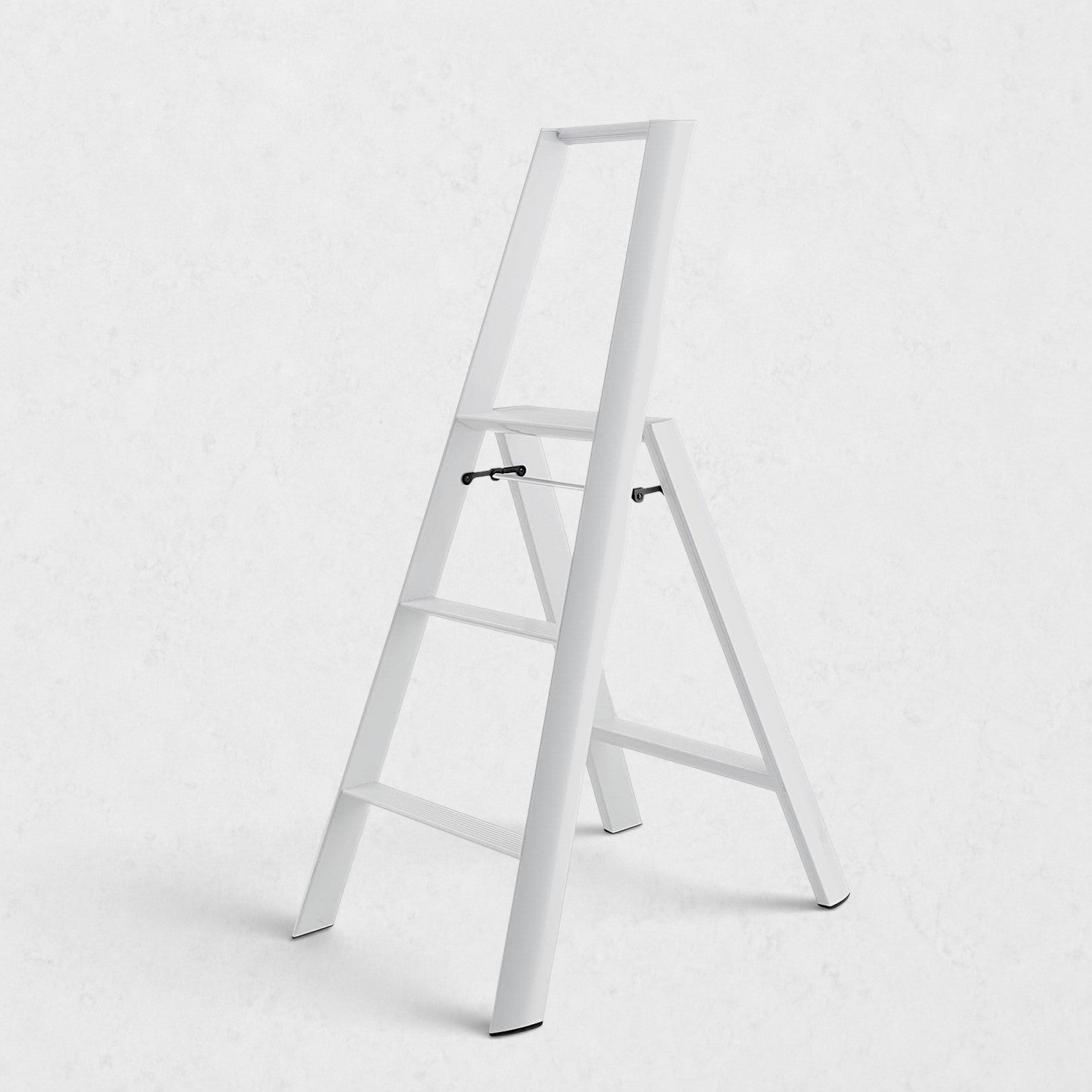 Hudson Grace white Hasegawa Lucano 3-step ladder with a minimalist aluminum and steel design and non-skid feet.