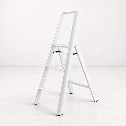 White Hasegawa Lucano 3-step ladder in matte white aluminum and steel with a safety bar and non-skid feet.