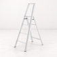 White Hasegawa Lucano 4-step ladder in matte white aluminum and steel with a minimalist design and safety bar.