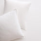 Two white Italian percale Euro shams, crisp cotton fabric with envelope closures, on a light background.
