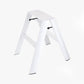 White Lucano Hasegawa 2-step ladder, aluminum and steel, with grooved treads and black non-skid feet.
