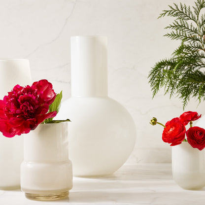 White Maartje Vase, 8.7"H handblown opaque glass, with a red peony.